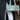 Person holding a light green handbag with a blurred background